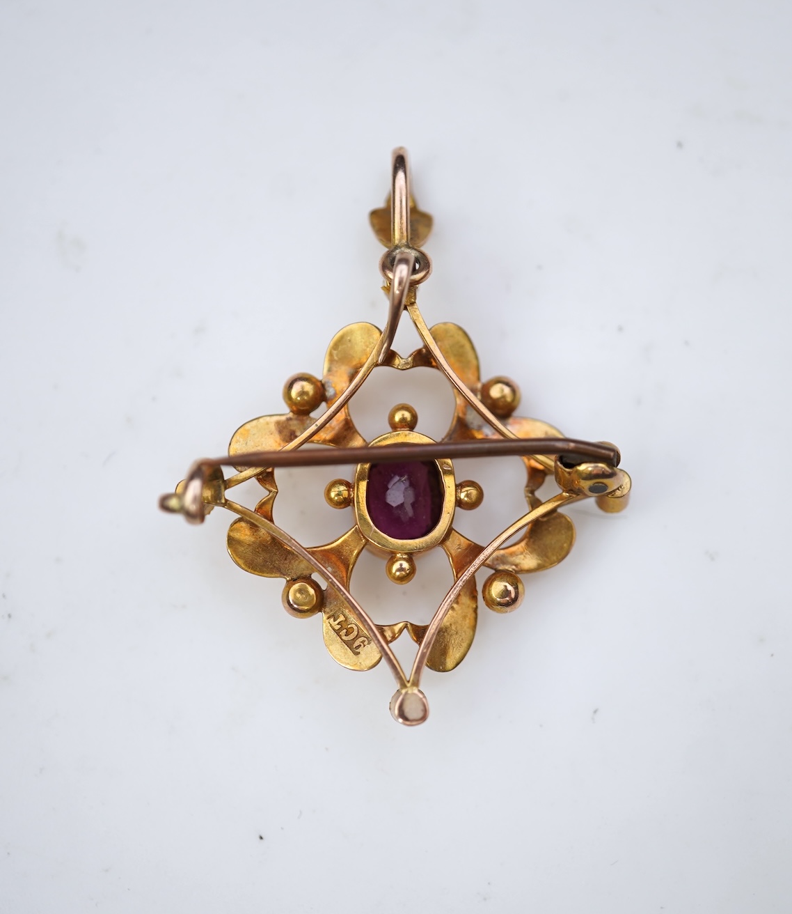 An Edwardian gold and garnet brooch/pendant, early 20th century
